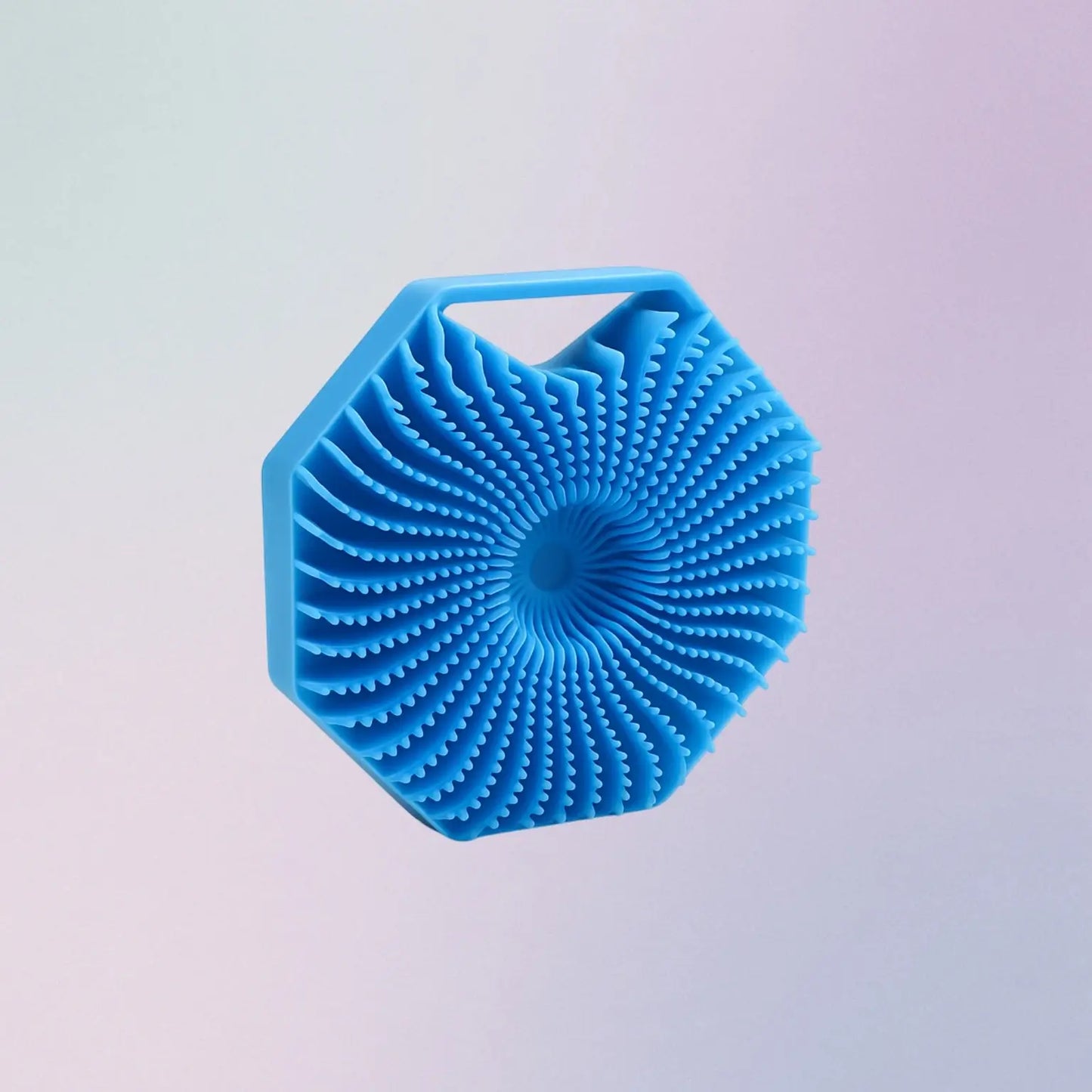 Blue silicone scrubber with hexagonal design on a light purple background