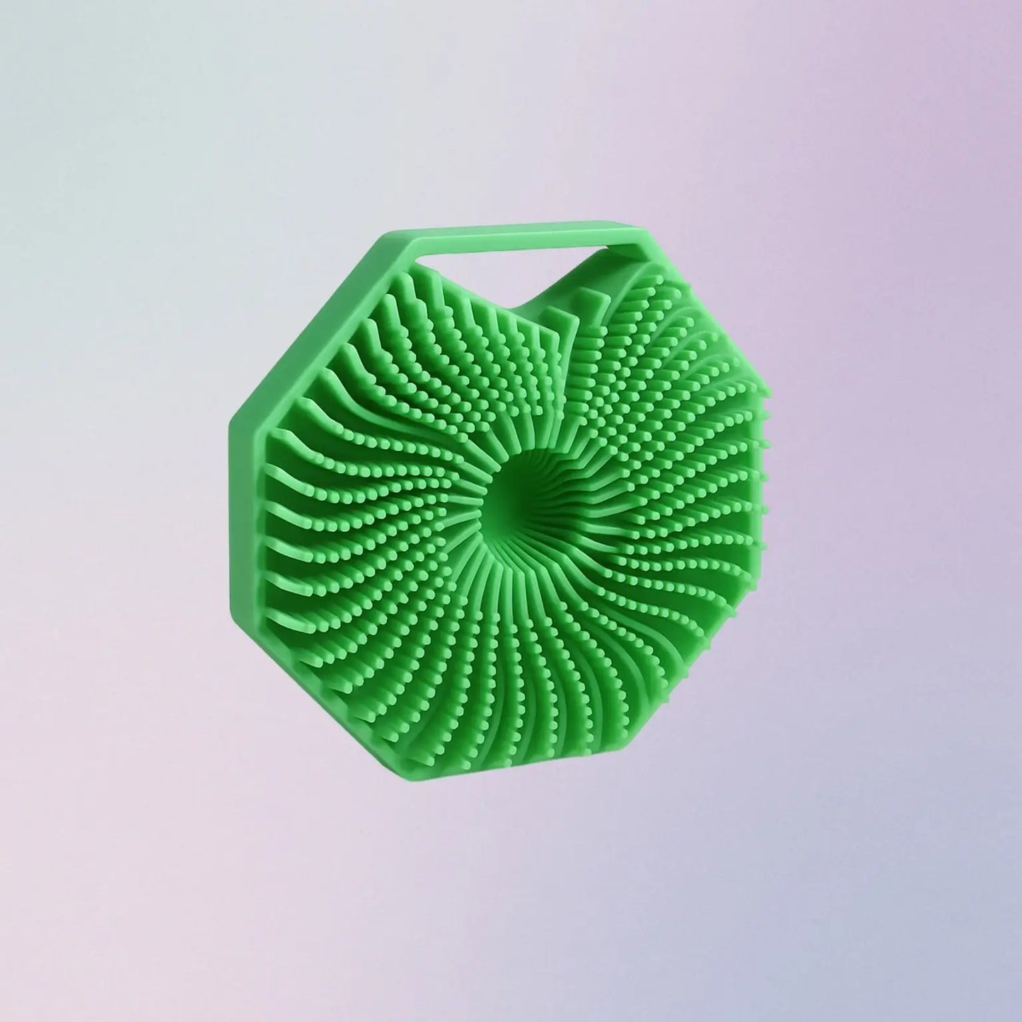 Green hexagonal scrubber on a light purple background