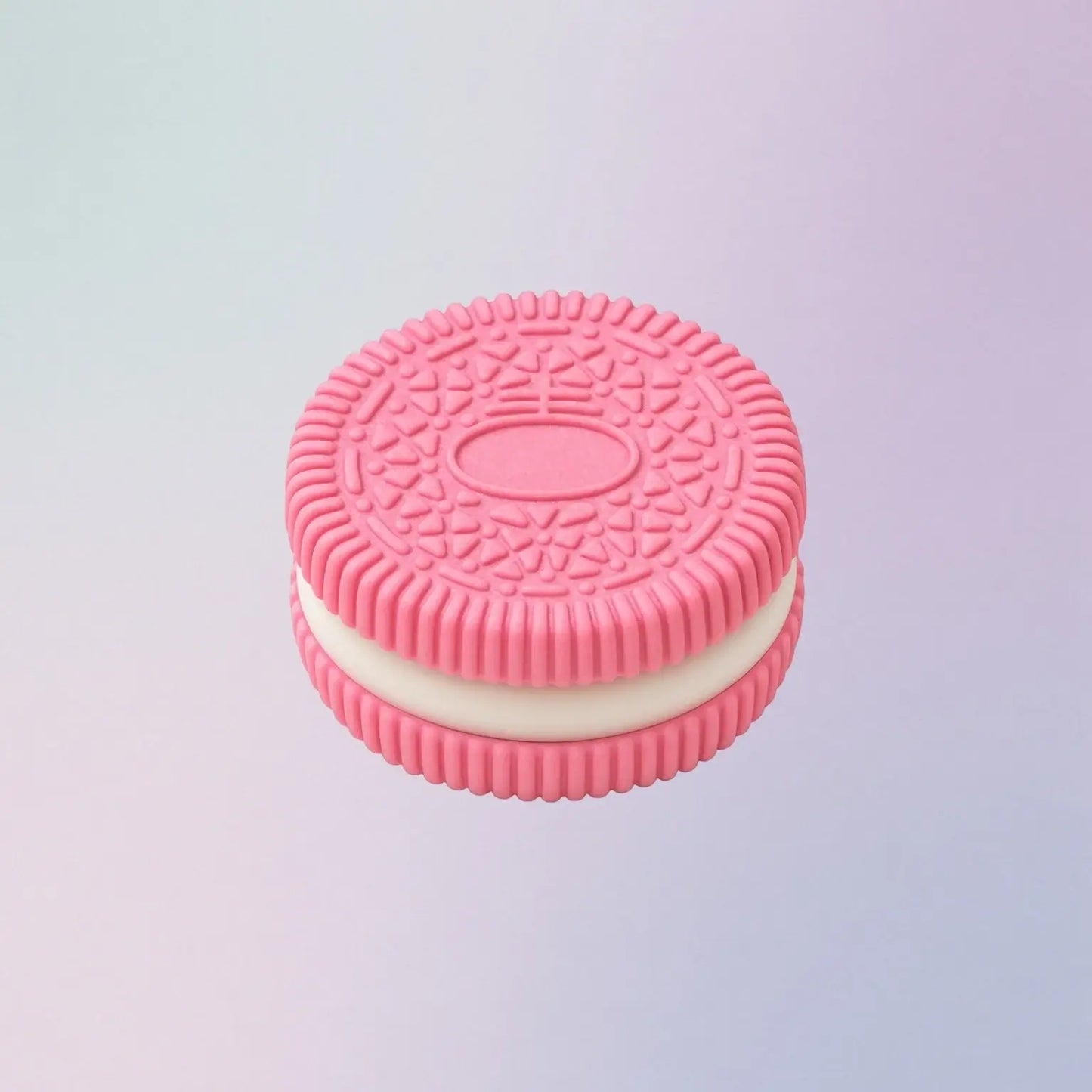 Pink oreo squishy with white filling on a light purple background
