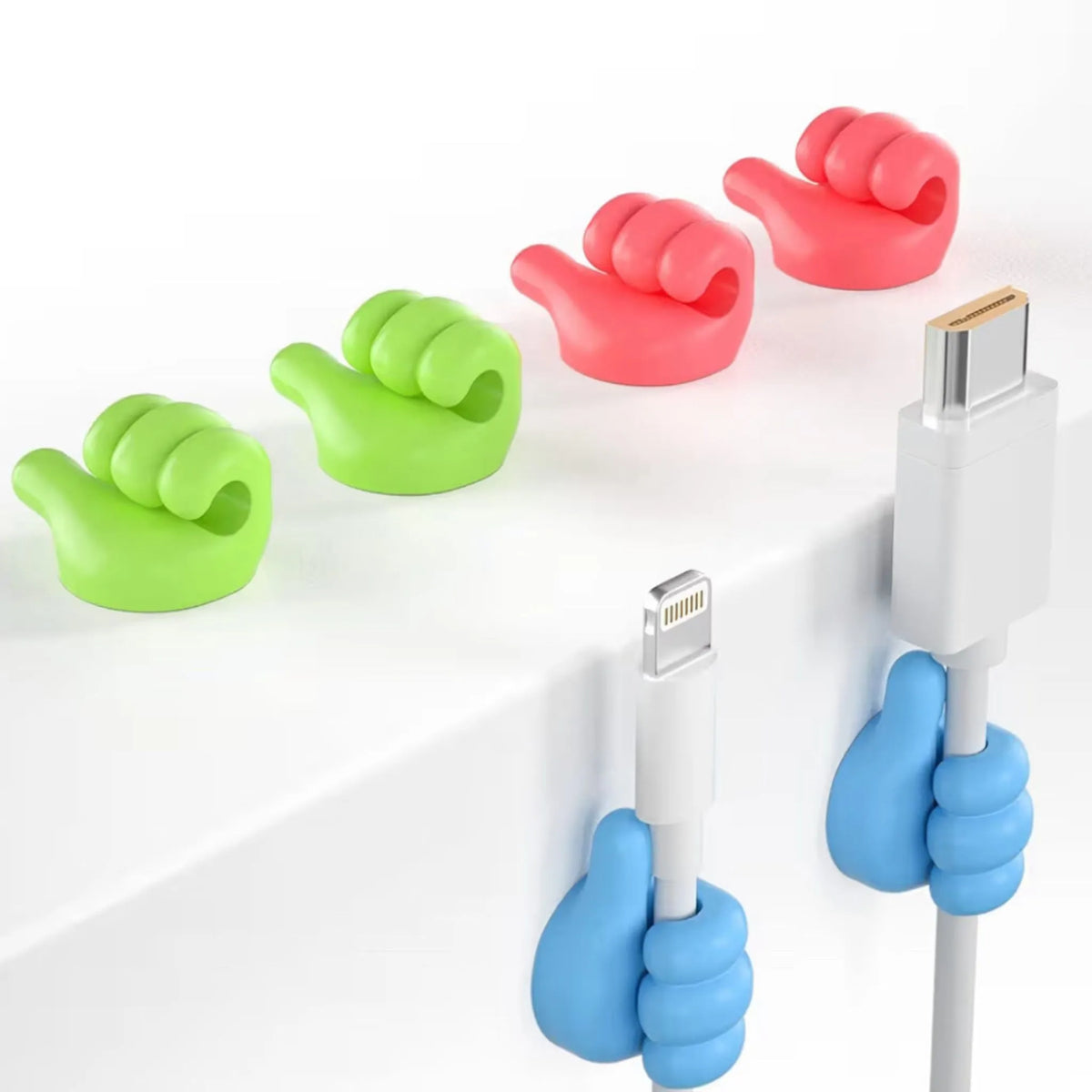 Adhesive finger hook holding a charging cable on a nightstand