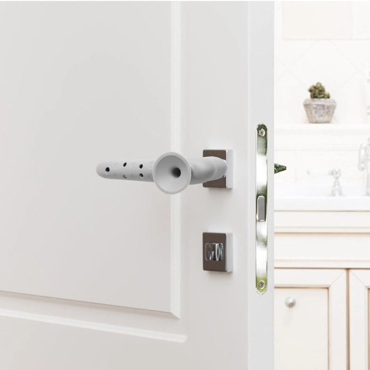 Silicone cover on a door handle protecting the wall behind it from dents