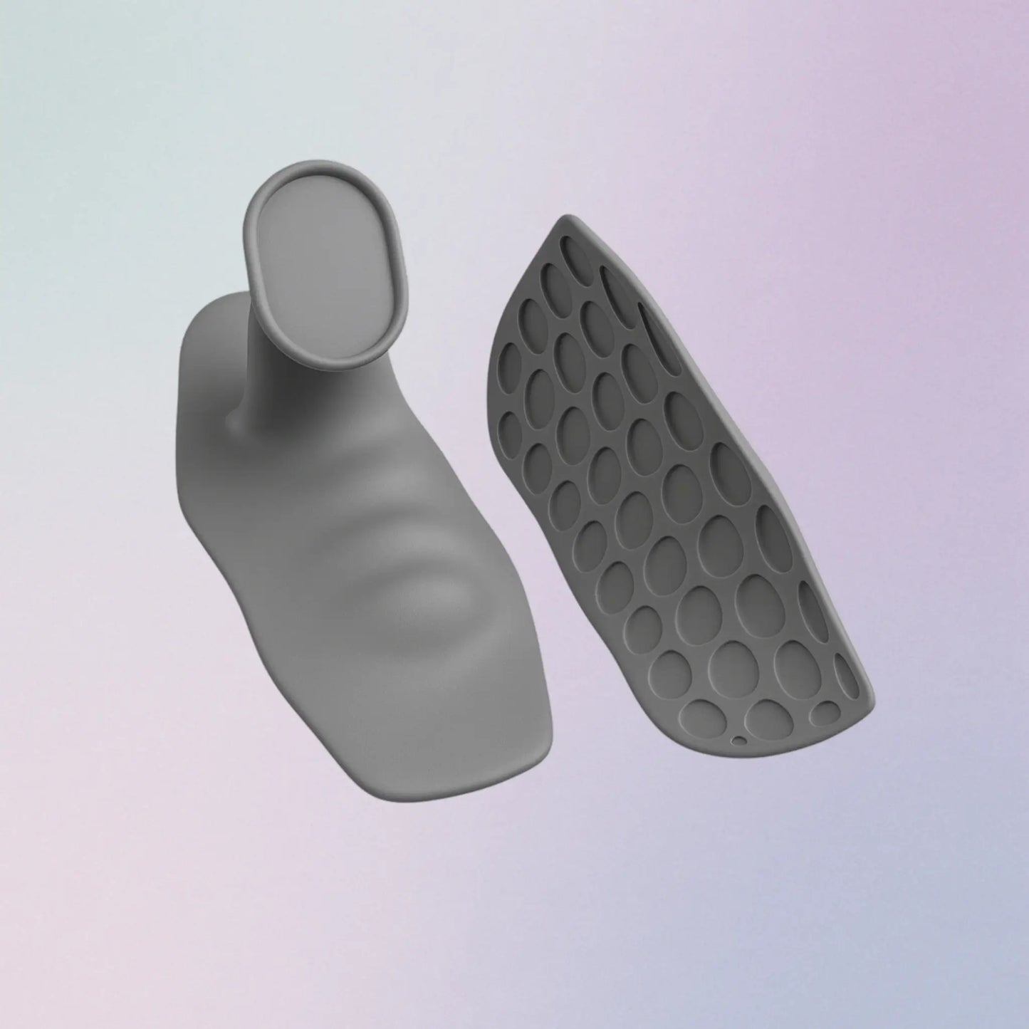 Gray silicone foot-shaped product with textured sole on a light purple background