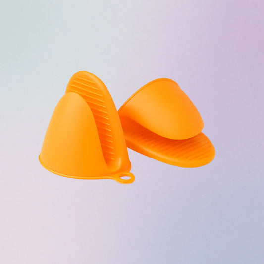 Orange silicone kitchen gloves on a light gray background