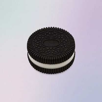 Black cookie-shaped Oreo squishy stress toy with white filling