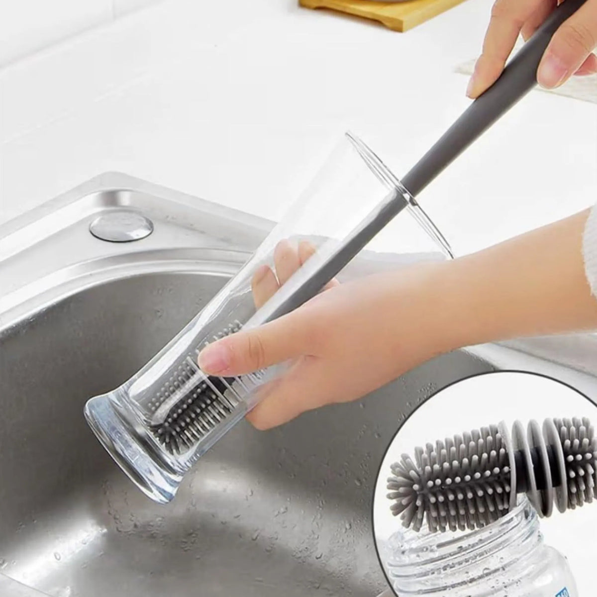 Silicone bottle brush scrubbing the inside of a water bottle