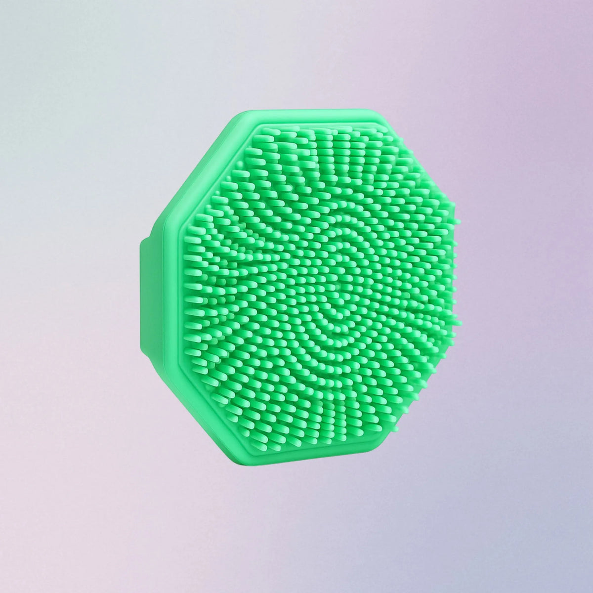 Green silicone face scrubber with soft bristles and finger grip