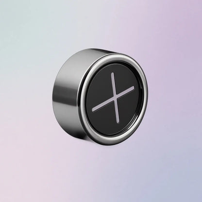 Round metallic towel hook with a black center on a gradient background