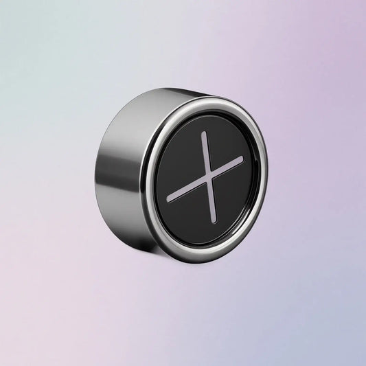 Round metallic towel hook with a black center on a gradient background